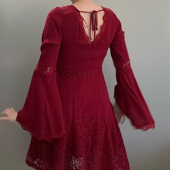 Francesca’s red bell sleeve mini dress with lace detail. - Picture 3 of 5